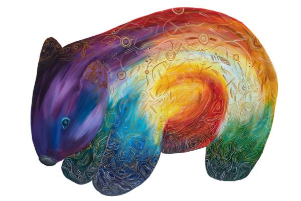 Rainbow coloured wombat with symbols etched into the surface by First Nation's artist Robert Michael Young