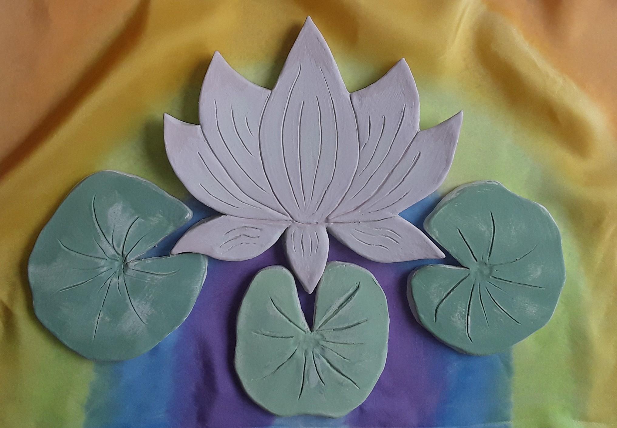 Purple lotus flower with three green leaves 