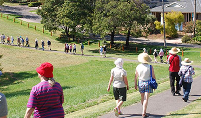 Photo of people walking through Ruffey Lake Park path