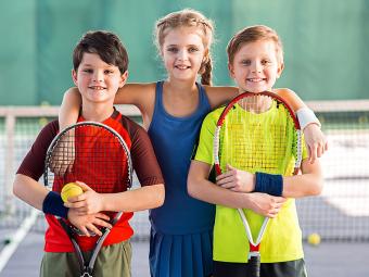 Group of kids with tennis rackets